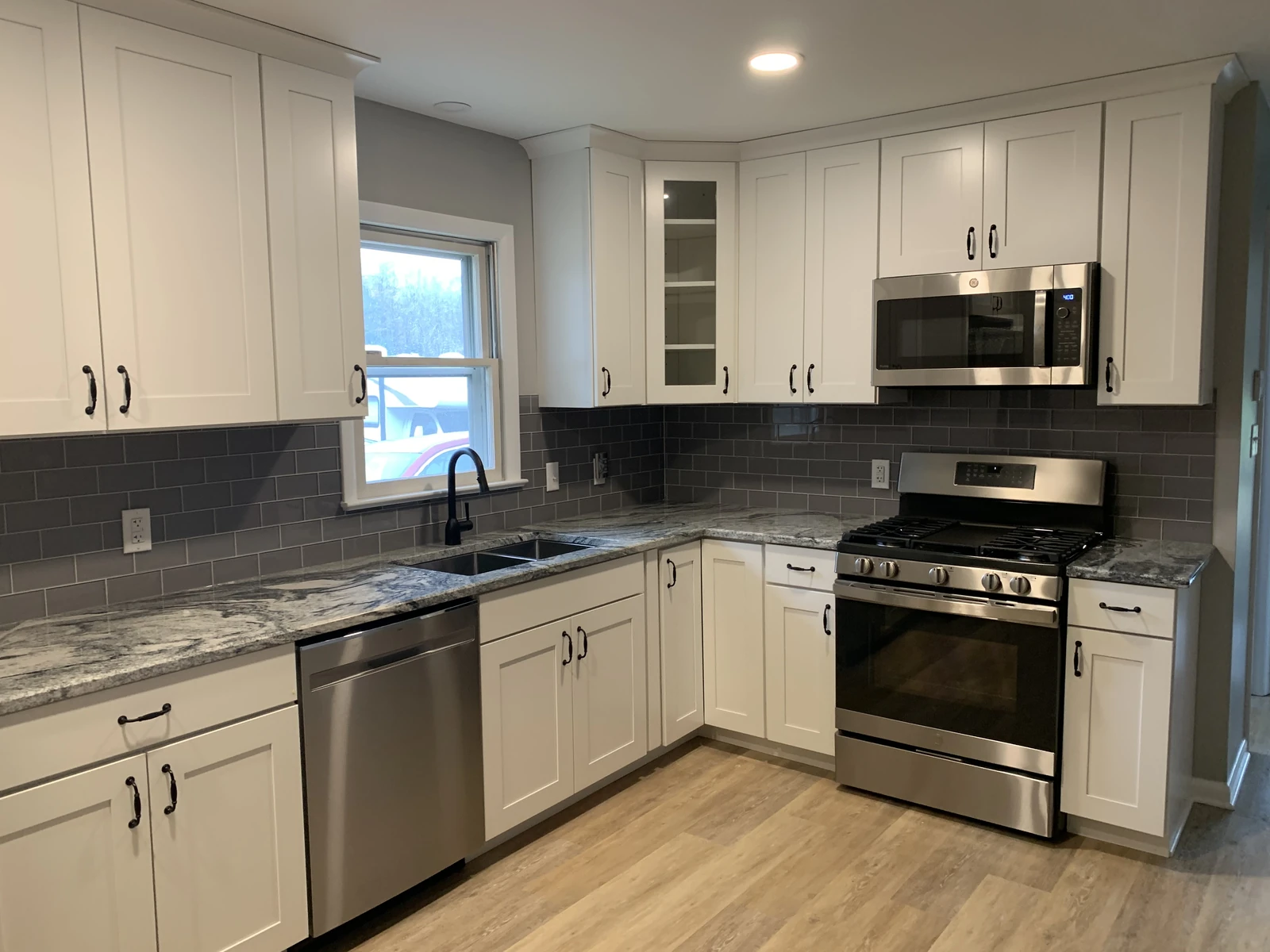White kitchen with gray subway tile