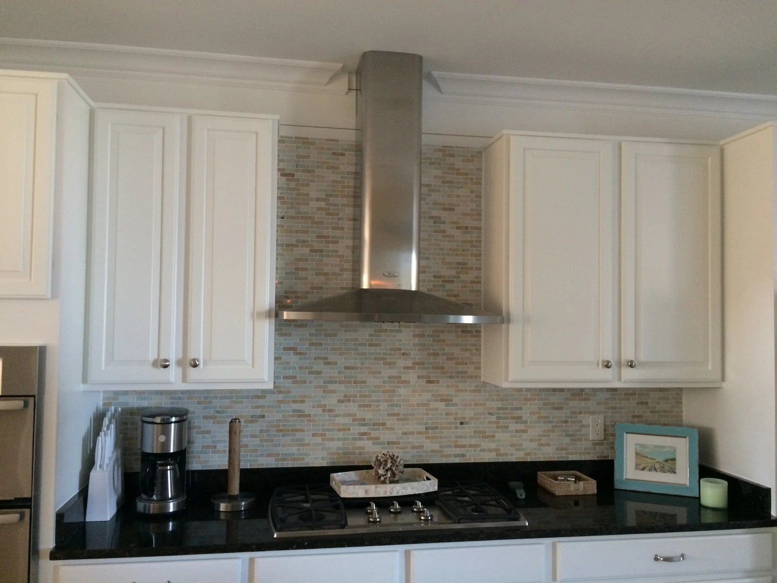 Same range wall after white spray cabinets